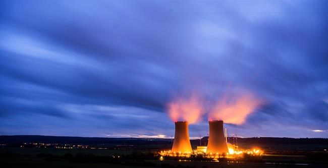 Steam rises from the cooling towers of the Grohnde nuclear power plant near Grohnde, Germany, Wednesday, Dec. 29, 2021. Germany on Friday, Dec. 31, 2021 is shutting down half of the six nuclear plants it still has in operation, a year before the country draws the final curtain on its decades-long use of atomic power. (Julian Stratenschulte/dpa via AP)