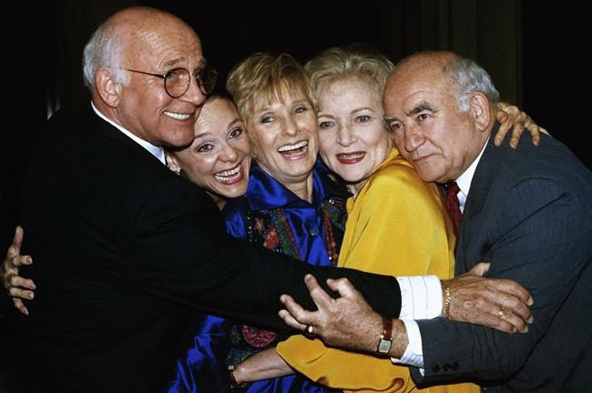 FILE - Former cast members of the Mary Tyler Moore Show, sans Mary Tyler Moore, are reunited for the Museum of Television and Radio's 9th annual Television Festival in Los Angeles on March 21, 1992. From left are Gavin MacLeod, Valerie Harper, Cloris Leachman, Betty White and Ed Asner. Betty White, whose saucy, up-for-anything charm made her a television mainstay for more than 60 years, has died. She was 99.  (AP Photo/Craig Fujii, File)