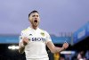 Leeds United's Jack Harrison celebrates scoring his side's first goal of the game , during the English Premier League soccer match between Leeds United and Burnley, at Elland Road, in Leeds. England, Sunday, Jan. 2, 2022. (Mike Egerton/PA via AP)