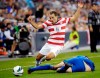 FILE - United States defender Steven Cherundolo (6) leaps over a sliding Guatemala forward Minor Lopez (22) during the second half of a World Cup qualifying soccer match in Kansas City, Kan., Tuesday, Oct. 16, 2012. Former U.S. national team member Steve Cherundolo has been named Los Angeles FC's new head coach. LAFC confirmed Cherundolo's hiring Monday, Jan. 3, 2021, as the replacement for Bob Bradley, the first coach in the expansion franchise's history. (AP Photo/Reed Hoffmann, File)