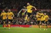 Wolverhampton Wanderers' Joao Moutinho celebrates after scoring his side's first goal during the English Premier League soccer match between Manchester United and Wolverhampton Wanderers at Old Trafford stadium in Manchester, England, Monday, Jan.3, 2022. (AP Photo/Dave Thompson)