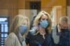 Elizabeth Holmes, center, enters federal court in San Jose, Calif., Monday, Jan. 3, 2022. (AP Photo/Nic Coury)