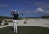 Tony Finau, of the United States, watches his tee shot on the 7th tee during the final round of the Hero World Challenge PGA Tour at the Albany Golf Club, in New Providence, Bahamas, Sunday, Dec. 5, 2021.(AP Photo/Fernando Llano)