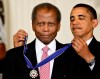 FILE - President Barack Obama presents the 2009 Presidential Medal of Freedom to Sidney Poitier during ceremonies in the East Room at the White House in Washington on, Aug. 12, 2009. Poitier, the groundbreaking actor and enduring inspiration who transformed how Black people were portrayed on screen, became the first Black actor to win an Academy Award for best lead performance and the first to be a top box-office draw, died Thursday, Jan. 6, 2022 in the Bahamas. He was 94. (AP Photo/J. Scott Applewhite, File)
