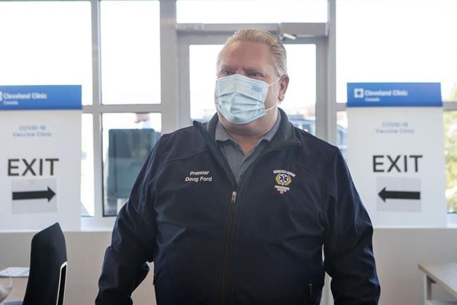 Ontario Premier Doug Ford arrives at a vaccine clinic for Purolator employees and their families at the company's plant in Toronto, Friday, Jan. 7, 2022. Ontario is rolling out a new $10,000 grant for small businesses shuttered by the latest round of public health measures, the province announced Friday. THE CANADIAN PRESS/Chris Young