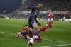 Manchester City's Kyle Walker, top, is challenged by Swindon's Ellis Iandolo during the English FA Cup third round soccer match between Swindon Town and Manchester City at the County Ground stadium in Swindon, Wiltshire, England, Friday, Jan. 7, 2022. (AP Photo/Kirsty Wigglesworth)