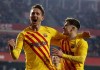 Barcelona's L. De Jong celebrates scoring the opening goal during the Spanish La Liga soccer match between Granada and Barcelona at Los Carmenes stadium in Granada, Spain, Saturday, Jan. 8, 2022. (AP Photo/Fermin Rodriguez)