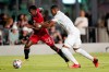 Toronto FC midfielder Richie Laryea (22) runs with the ball as Inter Miami defender Christian Makoun defends during the second half of an MLS soccer match,&nbsp;in Fort Lauderdale, Fla., Wednesday, Oct. 20, 2021. Laryea, 27, of Toronto, has signed with Nottingham Forest, which currently stands ninth in England's second-tier Championship. THE CANADIAN PRESS/AP-Lynne Sladky