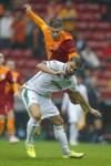 Konyaspor's Ahmet Calik, bottom, battles for the ball with Galatasaray's Halil Dervisoglu during the Turkish Super League soccer match between Galatasaray and Konyaspor at Nef stadium in Istanbul, Turkey, Sunday, Oct. 17, 2021. Former Galatasaray defender and Turkey international Ahmet Calik has died in a traffic accident near Ankara, his current club announced on Tuesday, Jan. 11, 2022. (AP Photo)