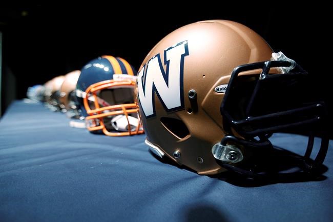 The new Winnipeg Blue Bombers 1980s-style logo is unveiled at a press conference at Canada Inn Stadium in Winnipeg, Tuesday, April 24, 2012. he Winnipeg Blue Bombers agreed to terms on a one-year contract extension with Canadian offensive lineman Pat Neufeld on Tuesday. THE CANADIAN PRESS/John Woods