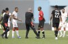 Tunisia's head coach Mondher Kebaier, center left, gestures to the referee Janny Sikazwe of Zambia, during the African Cup of Nations 2022 group F soccer match between Tunisia and Mali at the Limbe Omnisport Stadium in Limbe, Cameroon, Wednesday, Jan. 12, 2022. (AP Photo/Sunday Alamba)