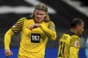 Dortmund's Erling Haaland, left, reacts during the German Bundesliga soccer match between Eintracht Frankfurt and Borussia Dortmund in Frankfurt, Germany, Saturday, Jan. 8, 2022. Dortmund defeated Frankfurt by 3-2. (AP Photo/Michael Probst)