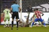 Athletic Bilbao's goalkeeper Unai Simon scores an own goal during the Spanish Super Cup semi final soccer match between Atletico Madrid and Athletic Bilbao at King Fahd stadium in Riyadh, Saudi Arabia, Thursday, Jan. 13, 2022. (AP Photo/Hassan Ammar)