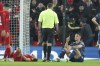 Arsenal's Granit Xhaka, left, speaks to the referee after seeing the red card during the EFL Cup semifinal, first leg soccer match between Liverpool and Arsenal at the Anfield Stadium in Liverpool, Thursday, Jan.13, 2022.(AP Photo/Jon Super)