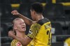 Dortmund's Erling Haaland, left, celebrates his goal with his teammate Jude Bellingham against Freiburg during the German Bundesliga soccer match between Borussia Dortmund and SC Freiburg in Dortmund, Germany, Friday, Jan. 14, 2022. (AP Photo/Martin Meissner)