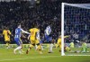 Crystal Palace's Joachim Andersen scores an own goal during the English Premier League soccer match between Brighton & Hove Albion and Crystal Palace at the AMEX Stadium, Brighton, England, Friday, Jan. 14, 2022. (Gareth Fuller/PA via AP)