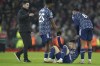 Arsenal's Gabriel Martinelli is picked up from the pitch by team mates as Arsenal's manager Mikel Arteta approaces at the end of the EFL Cup semifinal, first leg soccer match between Liverpool and Arsenal at the Anfield Stadium in Liverpool, Thursday, Jan.13, 2022.(AP Photo/Jon Super)