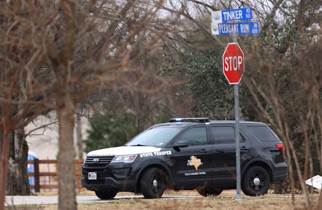 Police secure the area around Congregation Beth Israel synagogue on Saturday, Jan. 15, 2022 in Colleyville, Texas. Authorities say a man has apparently taken hostages at the synagogue near Fort Worth, Texas. The Colleyville Police Department tweeted Saturday afternoon that it was conducting SWAT operations at the address of Congregation Beth Israel. (Amanda McCoy/Star-Telegram via AP)