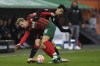 Augsburg's Arne Maier, left, and Frankfurt's Daichi Kamada fight for the ball during the German Bundesliga soccer match between Eintracht Frankfurt and FC Augsburg at the WWK Arena in Augsburg, Germany, Sunday, Jan. 16, 2022. (AP Photo/Andreas Schaad)