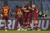 Roma's Sergio Oliveira, center, is cheered by teammates after scoring during the Serie A soccer match between Roma and Cagliari at Rome's Olympic stadium, Sunday, Jan. 16, 2022. (AP Photo/Andrew Medichini)