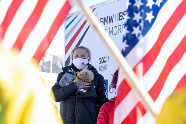 Winner Kaillie Humphries of USA on the podium after the Women's Monobob World Cup in St. Moritz, Switzerland, on Saturday, Jan. 15, 2022. (Mayk Wendt)/Keystone via AP)