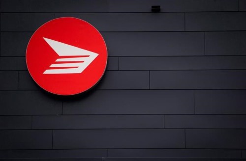 The Canada Post logo is seen on the outside the company's Pacific Processing Centre, in Richmond, B.C., on June 1, 2017. A claim by Chinese health authorities that the Omicron variant was introduced to a resident of Beijing through a piece of regular mail from Canada is being dismissed as ludicrous. THE CANADIAN PRESS/Darryl Dyck