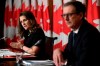 Governor of the Bank of Canada Tiff Macklem listens as Deputy Prime Minister and Minister of Finance Chrystia Freeland speaks during a joint news conference in Ottawa, on Monday, Dec. 13, 2021. THE CANADIAN PRESS/Justin Tang