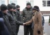 In this photo provided by Ukrainian National Guard Press Office Canada's Minister of Foreign Affairs Melanie Joly, right, greets Ukrainian soldiers during her visit to the National Guard base close to Kyiv, Ukraine, Tuesday, Jan. 18, 2022. THE CANADIAN PRESS/AP-Ukrainian National Guard Press Office via AP