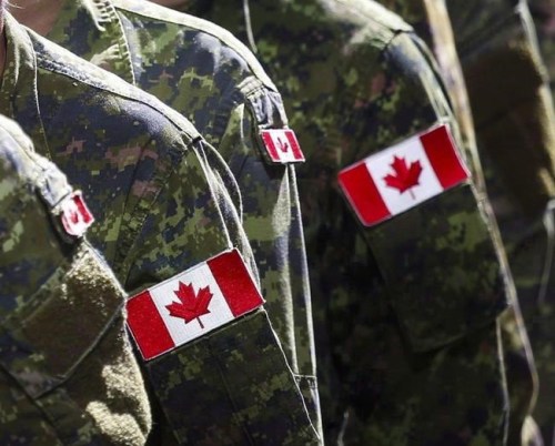 Members of the Canadian Armed Forces march during the Calgary Stampede parade in Calgary, Friday, July 8, 2016. Unvaccinated military members are in for a tougher fight than a retired soldier who was disciplined for refusing an anthrax vaccine 20 years earlier, his former lawyer warns. THE CANADIAN PRESS/Jeff McIntosh