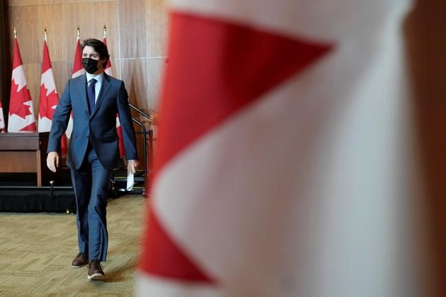 Canadian Prime Minister Justin Trudeau leaves a news conference Wednesday, Jan. 19, 2022, in Ottawa. THE CANADIAN PRESS/Adrian Wyld