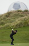 Northern Ireland's Rory McIlroy plays a shot on the 12th hole during the first round of the Abu Dhabi Championship golf tournament at the Yas Links Golf Course, in Abu Dhabi, United Arab Emirates, Thursday, Jan. 20, 2022. (AP Photo/Kamran Jebreili)