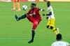 Toronto FC forward Ayo Akinola (20) moves the ball away from Columbus Crew defender Jonathan Mensah, right, during the first half of an MLS soccer match, Wednesday, May 12, 2021, in Orlando, Fla. THE CANADIAN PRESS/AP/John Raoux