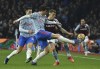 Manchester United's Victor Lindelof and Aston Villa's Lucas Digne challenge for the ball during the English Premier League soccer match between Aston Villa and Manchester United at Villa Park in Birmingham, England, Saturday, Jan. 15, 2022. (AP Photo/Rui Vieira)