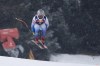 United States' Travis Ganong speeds down the course during an alpine ski, men's World Cup downhill training, in Kitzbuehel, Austria, Thursday, Jan. 20, 2022. (AP Photo/Giovanni Auletta)