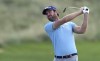 Scott Jamieson of Scotland plays a shot on the first hole during the third round of the Abu Dhabi Championship golf tournament at the Yas Links Golf Course in Abu Dhabi, United Arab Emirates, Saturday, Jan. 22, 2022. (AP Photo/Kamran Jebreili)