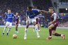 Everton's Yerry Mina, left, challenges for the ball with Aston Villa's Lucas Digne during the English Premier League soccer match between Everton and Aston Villa at the Goodison Park stadium, in Liverpool, England, Saturday Jan. 22, 2022. (AP Photo/Jon Super)