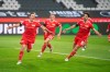 Union Berlin's Max Kruse, left, cheers with Union Berlin's Robin Knoche and Union Berlin's Rani Khedira after he scored the opening goal during the Bundesliga soccer match between Borussia Moenchengladbach and 1. FC Union Berlin in Moenchengladbach, Germany, Saturday, Jan. 22, 2022. (Bernd Thissen/dpa via AP)