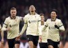 Liverpool's Fabinho celebrates scoring his side's third goal of the game with team-mates Jordan Henderson, left, and Takumi Minamino during the English Premier League soccer match between Crystal Palace and Liverpool at Selhurst Park, London, Sunday, Jan. 23, 2022. (Adam Davy/PA via AP)