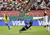Gabon's Aaron Boupendza, left, fails to score in front of Gabon's goalkeeper Anthony Mfa Mezui, middle, during the African Cup of Nations 2022 round of 16 match between Burkina Faso and Gabon at Omnisport Stadium in Limbe, Cameroon, Sunday, Jan. 23, 2022. (AP Photo/Sunday Alamba)