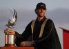 Thomas Pieters of Belgium holds the trophy after he won the Abu Dhabi Championship golf tournament at the Yas Links Golf Course, in Abu Dhabi, United Arab Emirates, Sunday, Jan. 23, 2022. (AP Photo/Kamran Jebreili)