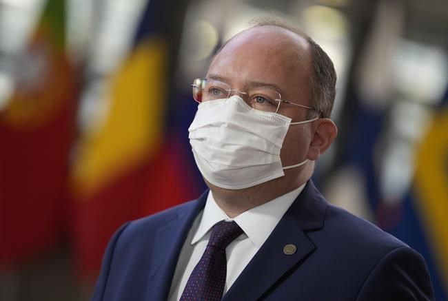 Romania's Foreign Minister Bogdan Aurescu arrives for a meeting of EU foreign ministers at the European Council building in Brussels, Monday, Jan. 24, 2022. European Union foreign ministers are aiming Monday to show a fresh display of resolve and unity in support of Ukraine, amid deep uncertainty about whether President Vladimir Putin intends to attack Russia's neighbor or send his troops across the border. (AP Photo/Virginia Mayo)