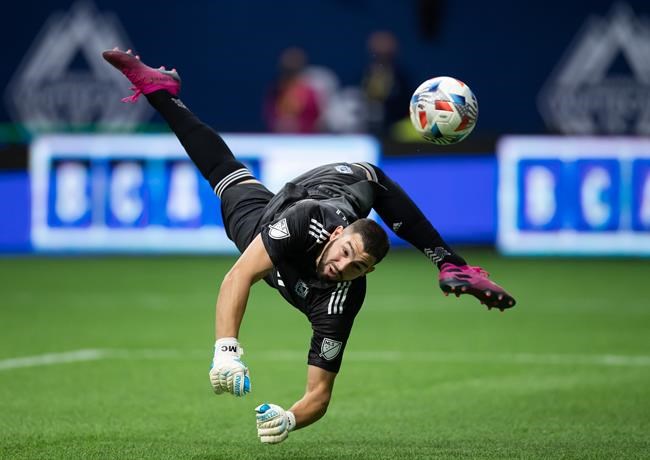 The ball deflects back off the post after Vancouver Whitecaps goalkeeper Maxime Crepeau made a diving save against Real Salt Lake during first half MLS soccer action in Vancouver, B.C., Sunday, Aug. 29, 2021. THE CANADIAN PRESS/Darryl Dyck