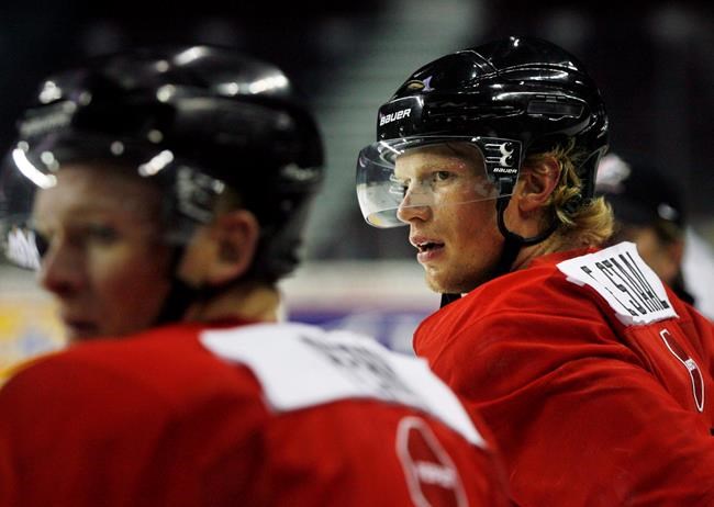 Eric Staal, right, from Thunder Bay, Ont., catches his breath during the Men's National Olympic Team orientation camp in Calgary, Monday, Aug. 24, 2009. THE CANADIAN PRESS/Jeff McIntosh