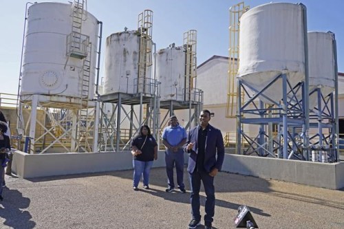 FILE - EPA Administrator Michael Regan, right, speaks to reporters at the O.B. Curtis Water Treatment Plant, a Ridgeland based facility near Jackson, Miss., about longstanding water issues that have plagued the city, on Nov. 15, 2021. The Environmental Protection Agency is taking a series of enforcement actions to address air pollution, unsafe drinking water and other problems in minority communities in three Gulf Coast states that Administrator Michael Regan visited as part of a 