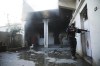 Soldiers with the U.S.-backed Syrian Democratic Forces h check a house in Hassakeh, Syria, Tuesday, Jen. 25, 2022. After breaking into the prison late Thursday, IS militants were joined by others rioting inside the facility that houses over 3,000 inmates, including hundreds of minors. They took hostages from among the prison staff and have since been holed up in the northern wing at one end of the facility, known as al-Sinaa or Gweiran prison. (AP Photo/Hogir Al Abdo)