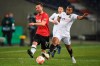 Hannover's Julian Borner, left, Monchengladbach's Alassane Plea battle for the ball during the German Soccer Cup round of 16 between Hannover 96 and Borussia Monchengladbach at the HDI Arena in Hanover, Germany, Wednesday Jan. 19, 2022. (Swen Pfartner/dpa via AP)