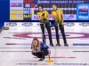 Wild Card 2 team skip Chelsea Carey watches a rock as Northern Ontario's Ashley Sippala, left, and Sarah Potts look on at the Scotties Tournament of Hearts at Fort William Gardens in Thunder Bay, Ont. on Friday, Jan. 28, 2022. THE CANADIAN PRESS/Andrew Vaughan