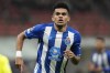 FILE - Porto's Luis Diaz celebrates after scoring his side's opening goal during the Champions League group B soccer match between AC Milan and Porto at the San Siro stadium in Milan, Italy, Nov. 3, 2021. Liverpool could strengthen its attacking options in the final days of the Jan. 2022 transfer window by signing Diaz, however Liverpool hasn't commented publicly about the potentially signing him. (AP Photo/Luca Bruno, File)