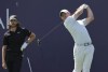 Rory McIlroy of Northern Ireland tees off on the 2nd hole during final round of the Dubai Desert Classic golf tournament in Dubai, United Arab Emirates, Sunday, Jan. 30, 2022. (AP Photo/Kamran Jebreili)