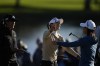Tournament winner Lydia Ko of New Zealand, center, goes in for a hug with second-place finisher Danielle Kang of the U.S., as Celine Boutier of France, who tied for fourth, looks on, as they finish on the 18th hole in the final round of the Gainbridge LPGA golf tournament, Sunday, Jan. 30, 2022, in Boca Raton, Fla. (AP Photo/Rebecca Blackwell)